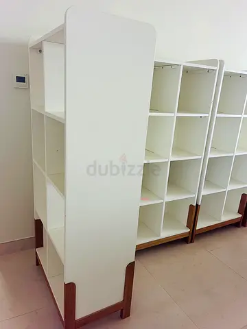 Shelves can be used for any matter. White Modular Cube Shelving Unit with Wooden Legs