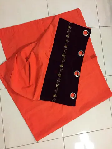 Orange eyelet curtain panel with embroidered black header - single panel