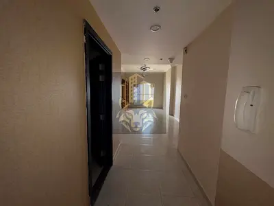 Spacious 2-Bedroom Apartment with Parking in Emirates City – AED 38,000 (4 Cheques)