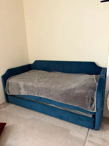 Blue upholstered single/twin bed frame with headboard