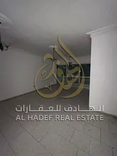 Save on your rent with free AC and parking in Al Majaz 2 | Two bedrooms, a spacious living room, and