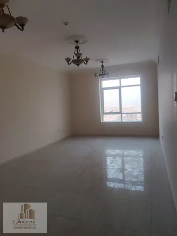 Apartment for sale in Al Maha Tower with a spacious area of 1500 sq ft, two bedrooms and a living r