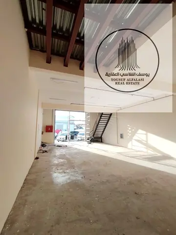 Warehouse available in Industrial Area 2, 2200 sq ft, on the main road. Price: AED 100,000 per year.