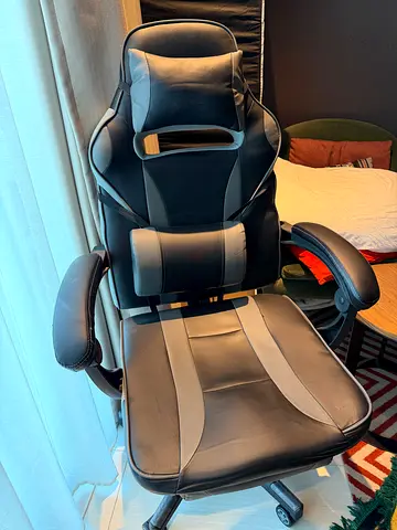 Comfortable black and grey ergonomic gaming/office chair with headrest and lumbar support