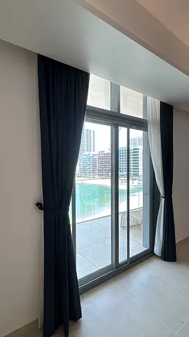 Dark navy blackout curtains with white sheer panels