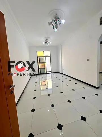 For annual rent: Two-bedroom apartment with a living room in Al Rawda area, near Sheikh Ammar Street, with two bathrooms and modern finishing.