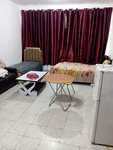 Spacious Master bedroom attached bath,c.ac, furnished for couples in Madina Zayed .