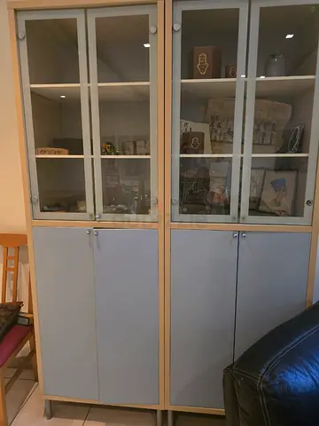 IKEA two-piece glass-door display cabinets - light wood finish (pair)