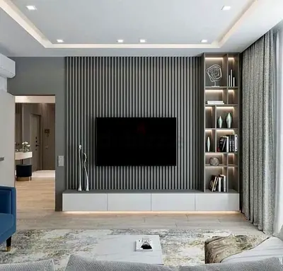Modern grey TV wall unit with built-in shelving and floating cabinet