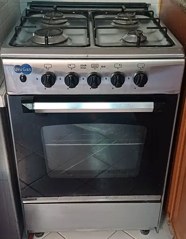 Used UniGas 4-burner Gas Cooker with Oven - Good Working Condition