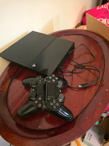 PlayStation 4 Slim with 2 DualShock Controllers and USB charging cable cable - Good Condition