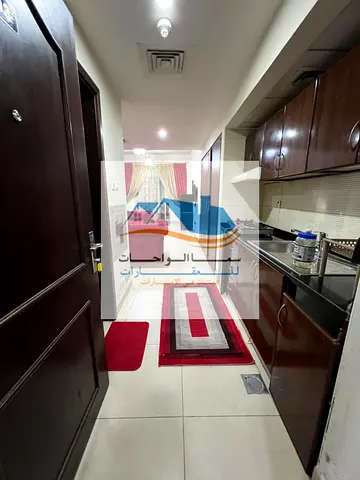 Furnished studio apartment with balcony overlooking Sheikh Khalifa Street in Ajman, Al Nuaimiya 1, Al Shurooq Towers, available for monthly rent