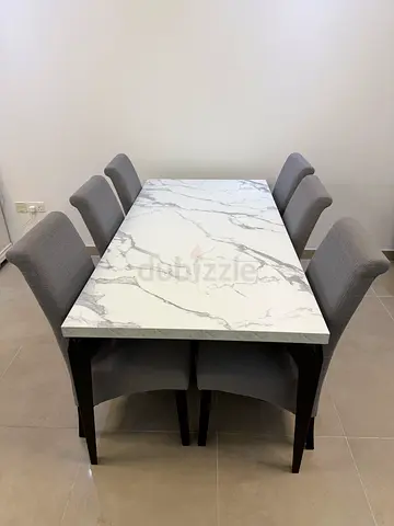 Six seater dining table and chairs