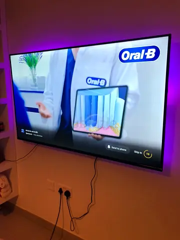 Samsung 65 LED Smart TV mounted with ambient backlight - Good working condition