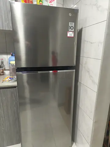 LG Silver double-door refrigerator in good condition