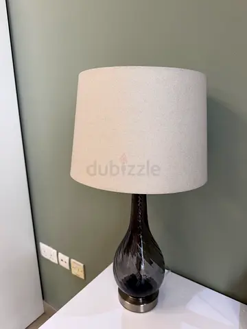 Elegant glass table lamp with neutral fabric shade