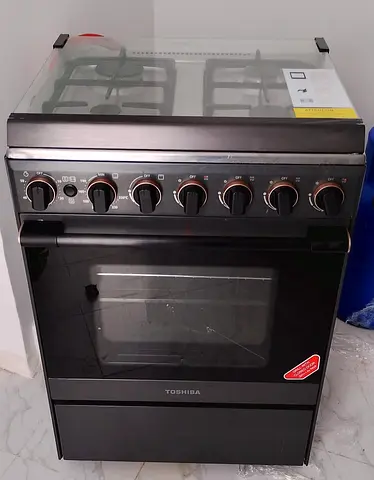Toshiba Gas Cooker with Oven (4 Burner).Rarely used in perfect condition.Please whatsapp no calls.