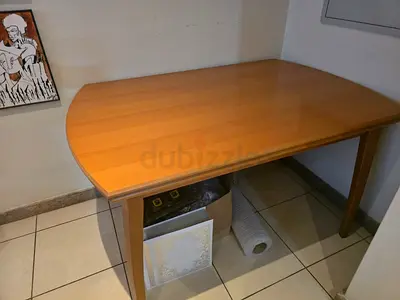 Solid wood dining table in good condition - medium size