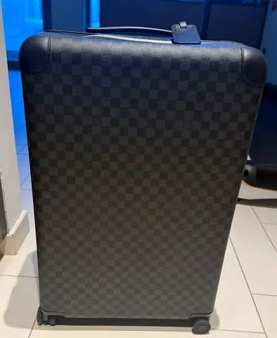 Louis Vuitton medium suitcase (around size 70 cm)
