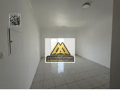 One-bedroom apartment with hall in Al Rashidiya 3, balcony, built-in wardrobes, central AC. 27,000 y