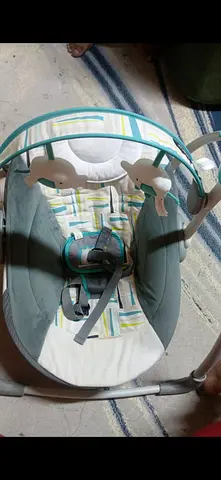 Almost new  baby swing/rocker with toy bar -carnger sht