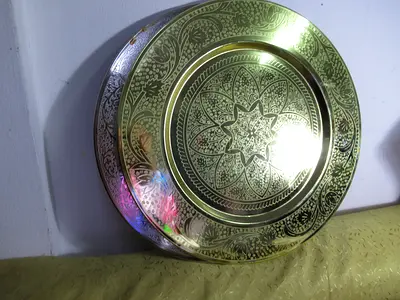 large gold colored metal serving or cake tray