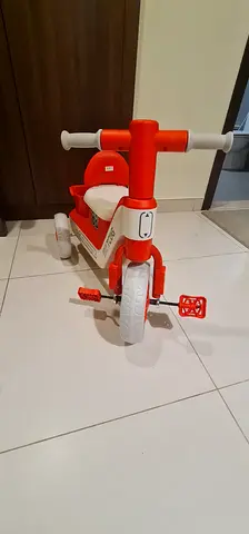 Red and white toddler ride-on tricycle toy - light use