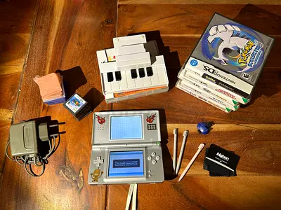 Nintendo DS console bundle with games, styluses and charger
