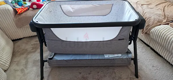 Electricity grey bedside bassinet/crib with storage shelf — good condition from giggles brand