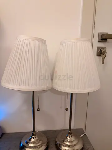 IKEA Pair of chrome table lamps with white pleated shades - one needs a bulb