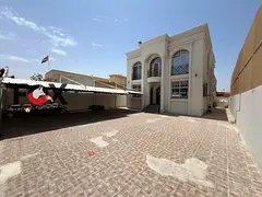 Spacious 5-bedroom villa with majlis and hall for rent in Al Rawda 2, next to a mosque, prime locati