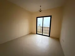 One bedroom, living room, two bathrooms, and a balcony; spacious areas available for annual rent.
