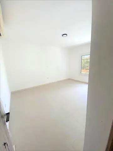 Premium 4-bedroom villa in Al Jazzat, Sharjah, first tenant, with maid’s room, large yard, and multiple free parking spaces.