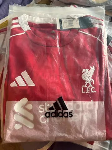 Brand new Adidas Liverpool FC home jersey (size tag visible) - unopened