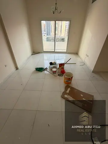 2BR Apartment Master Room Balcony Open View Free Parking Spacious Layout 2 Bathrooms Al Rashidiya 1 Near Pearl Towers Prime Location Close to Service