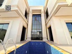 Villa for sale in Al Helio 2, Ajman. 6 master bedrooms with a swimming pool, corner lot facing a gar