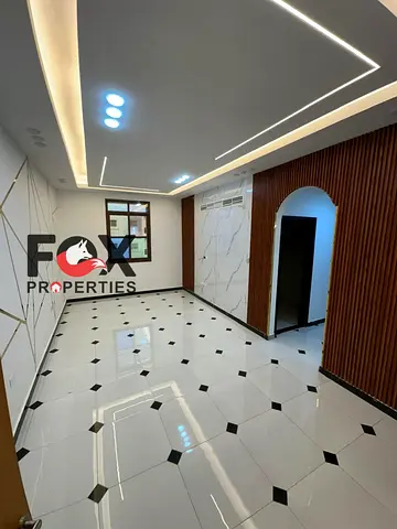 2BR apartment, 2 baths, modern building, second tenant, annual rent in Al Rawda 3, Ajman, near Sheikh Ammar St, close to all services.