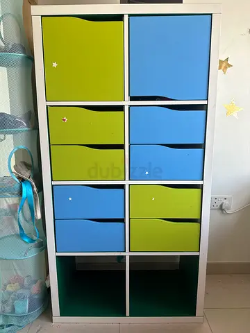 Ikea Kallax 2x4 childrens storage cubby unit with colorful bins