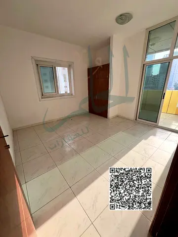 Spacious apartment for annual rent – ​​Al Rashidiya 3 | Two bedrooms, living room, two balconies, two bathrooms, central air conditioning, at a bargai
