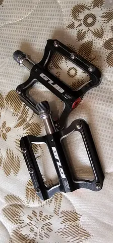 Well-used flat bicycle pedals (pair) - aluminum platform