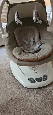 Graco Baby Swing/Rocker with Toys — Good Condition ( 1 month used)