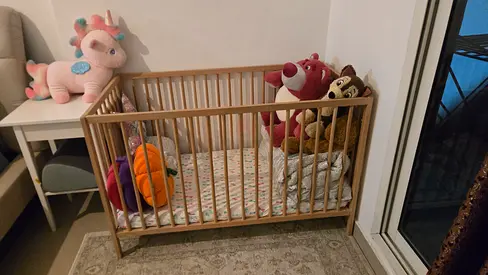 Solid wooden baby crib in good condition (single) - light oak