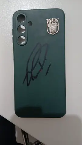 Used green phone case model A16 with signature from a goalkeeper from WAHDA FC Name ZAYED