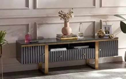 Modern low TV console with fluted doors and gold legs