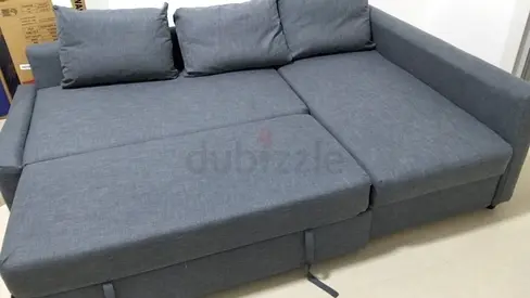 Ikea Gray L-shaped Sofa Bed with Storage - Comfortable and Spacious