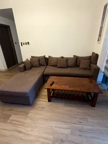 L-shaped custom Made  sofa in good condition - neutral brown fabric