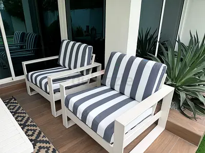 Outdoor sofa set. Table has adjustable height. Barely used.