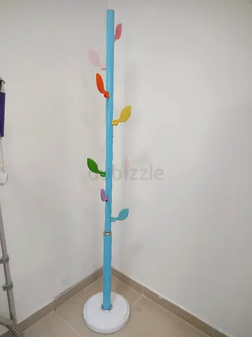 Light blue standing coat rack with colorful leaf hooks - good condition