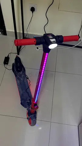 Red electric scooter with RGB light strip — good condition