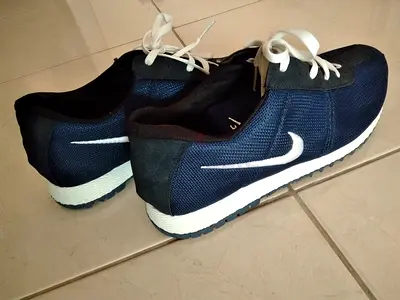Used navy blue Nike-style casual sneakers, size not specified, good condition